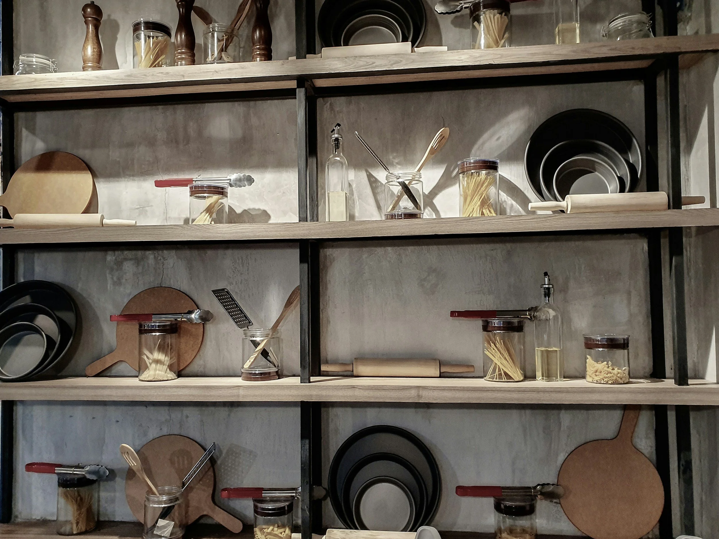 Kitchen shelves with organized cookware and kitchen essentials