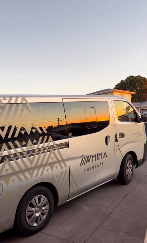 Company van with AWHINA PAINTERS logo parked on a driveway during sunset. Painting and decorating company Taranaki. New Plymouth. Dulux.