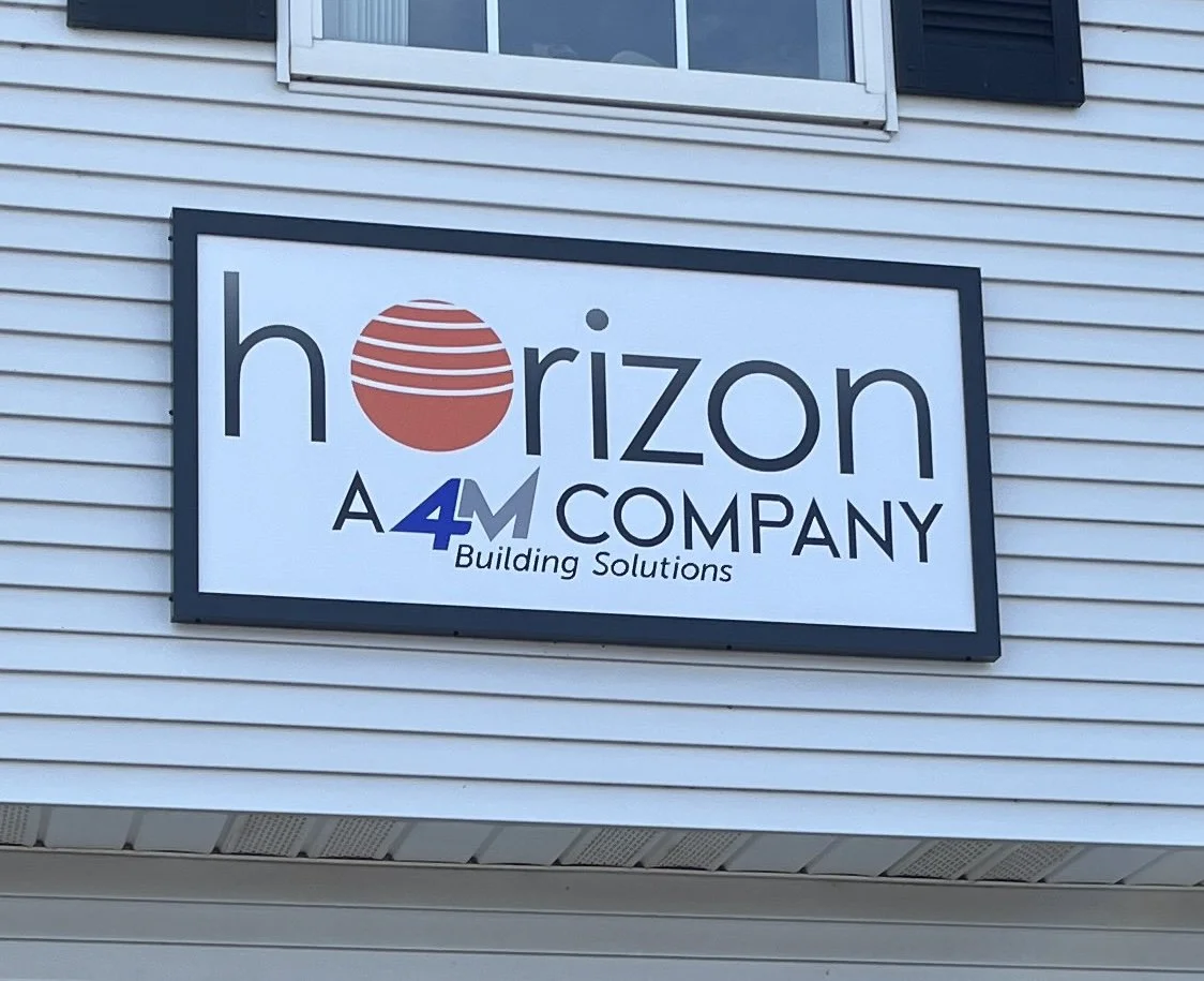 Full color business sign on a ACM panel finished with a black frame, installed in Manchester, CT