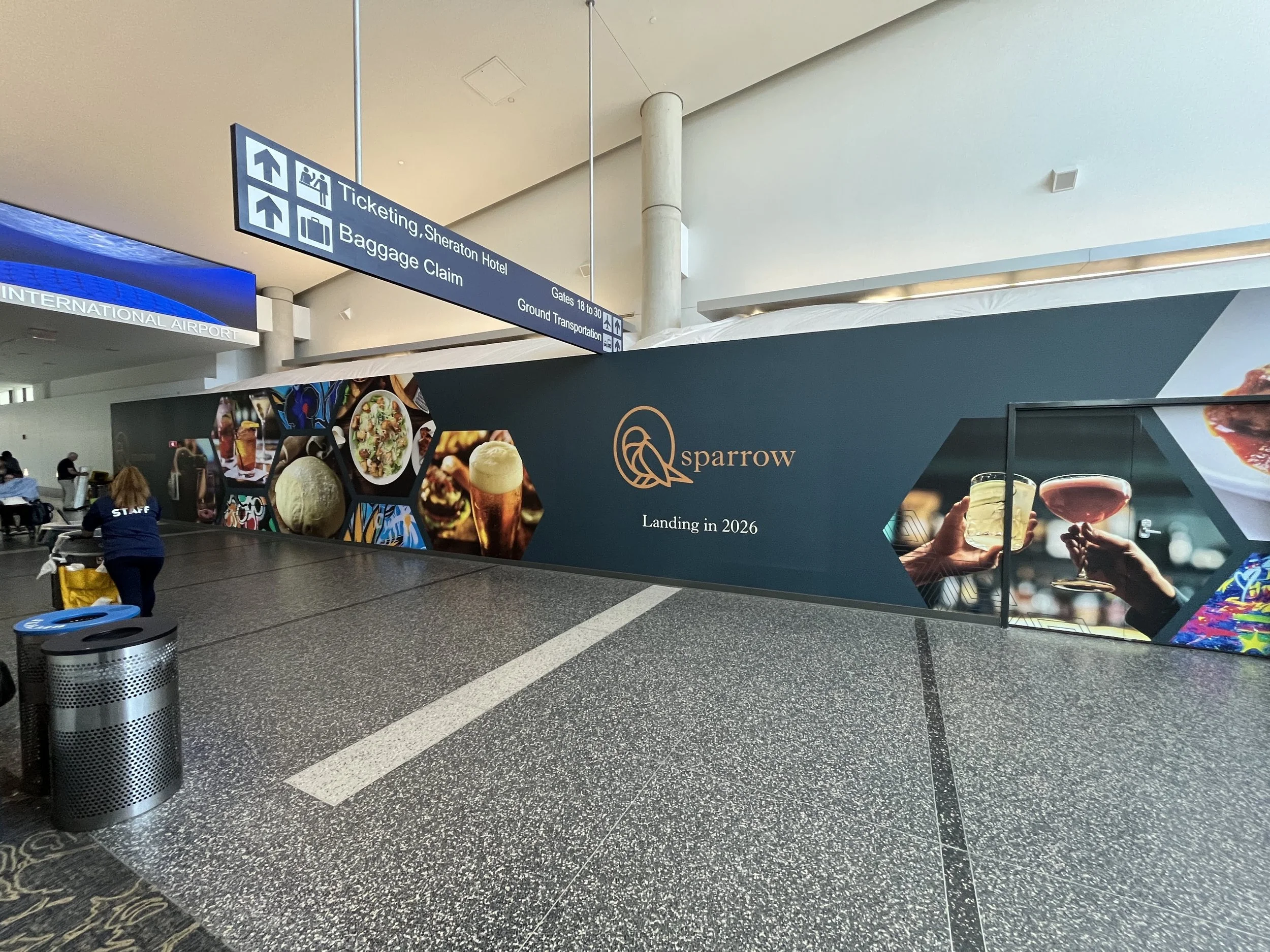 Another view of a Construction wall wrap for Sparrow Pizza inside Bradley Airport.