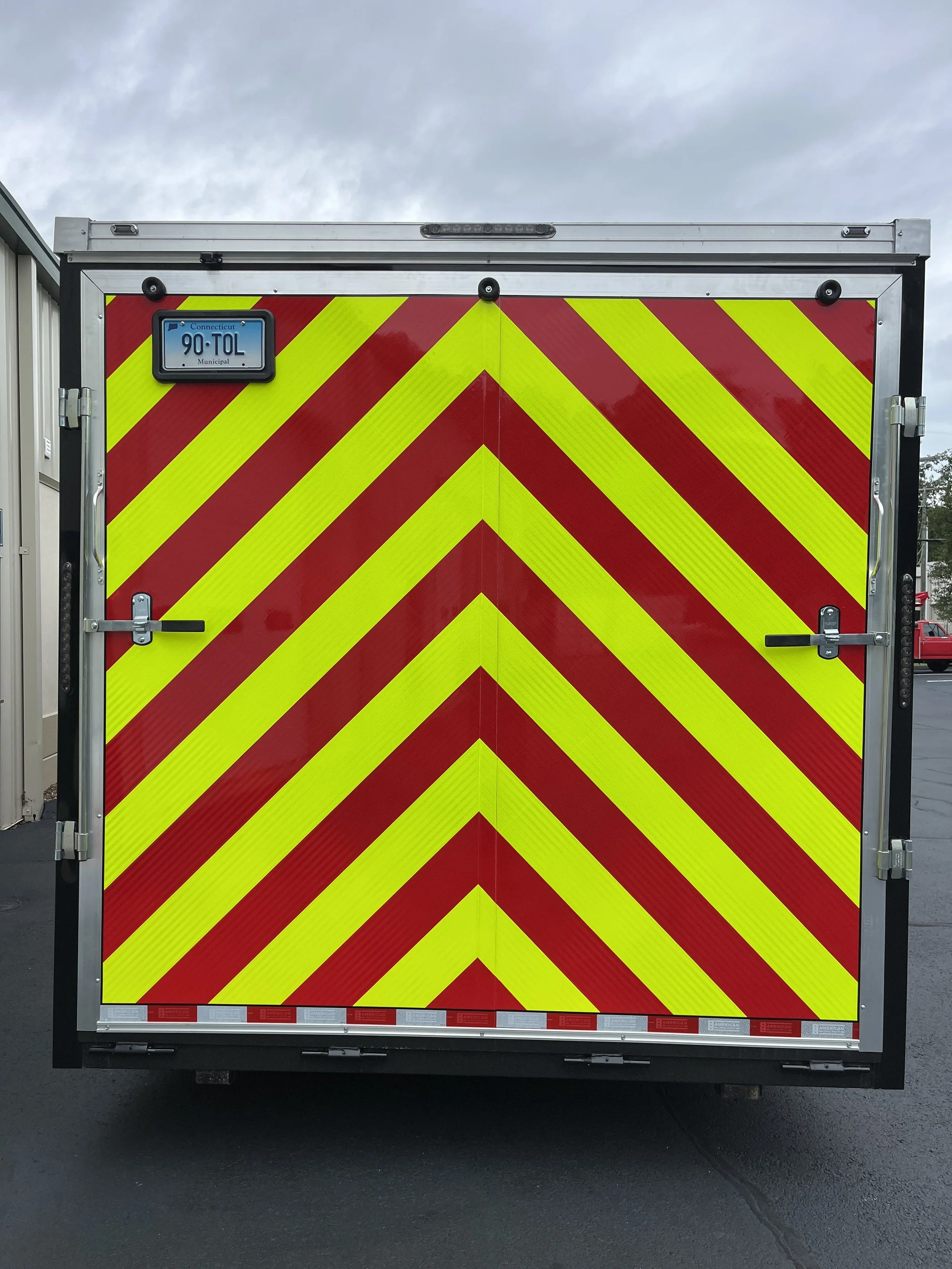3M yellow and red reflective striping chevron pattern with black pinstriped edge for Tolland FD