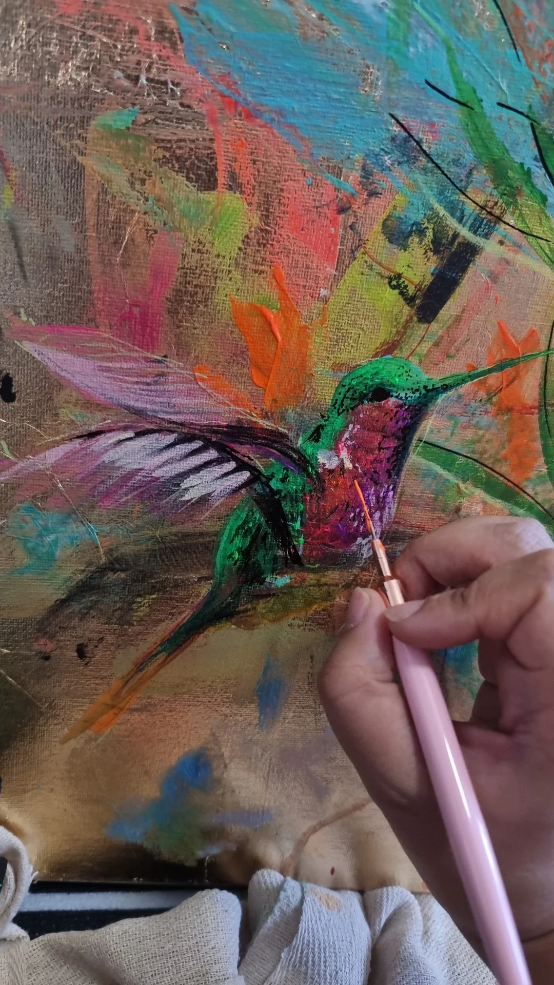 Close-up of a hummingbird on a textured canvas