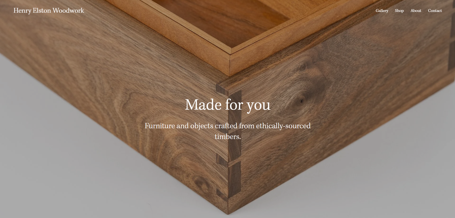 Close-up of a wooden furniture piece showing smooth, natural wood grain and dovetail joints, with the text 'Made for you' and a description about ethically-sourced timber.