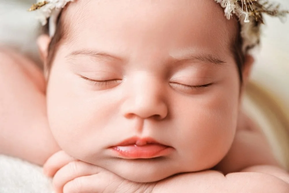 Newborn photography in Austin, Texas by Breeanna Rose Photography. Extreme closeup of sleeping newborn face.