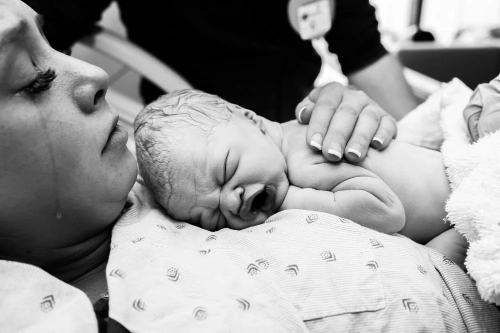 Birth photography in Austin, Texas by Breeanna Rose Photography. Birth story photograph, black and white.