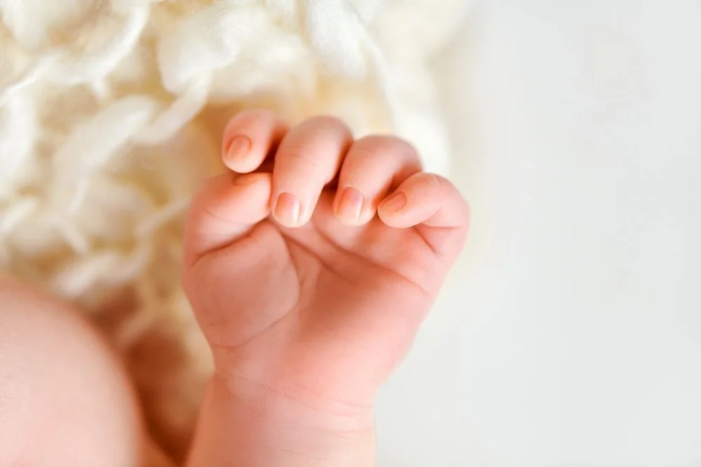 Newborn photography in Austin, Texas by Breeanna Rose Photography. Macro hand.