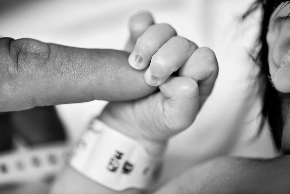 Birth photography in Austin, Texas by Breeanna Rose Photography. Birth story photograph, black and white.