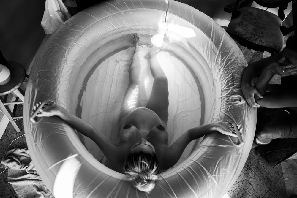 Birth photography in Austin, Texas by Breeanna Rose Photography. Overhead pool, spiral composition.