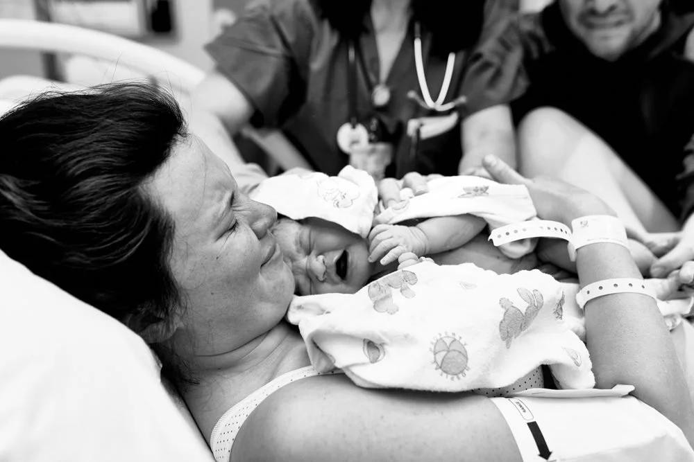 Birth photography in Austin, Texas by Breeanna Rose Photography. Baby just born, on mom.