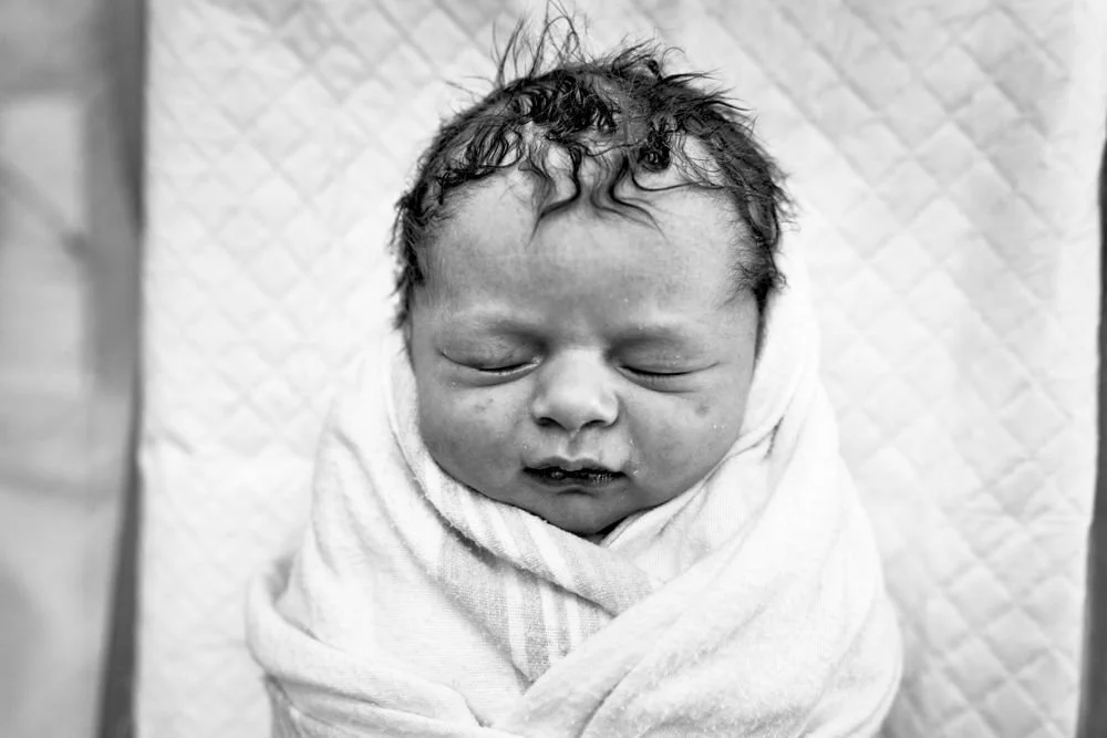 Birth photography in Austin, Texas by Breeanna Rose Photography. Birth story photograph, black and white.