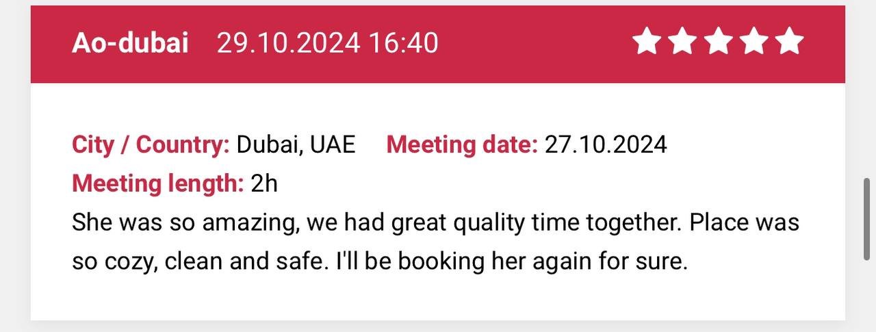 A review card with a red header displaying 'Ao-dubai 29.10.2024 16:40' and five stars. The main text shows 'City / Country: Dubai, UAE' and 'Meeting date: 27.10.2024', with a meeting length of 2 hours. The review states: 'She was so amazing, we had g