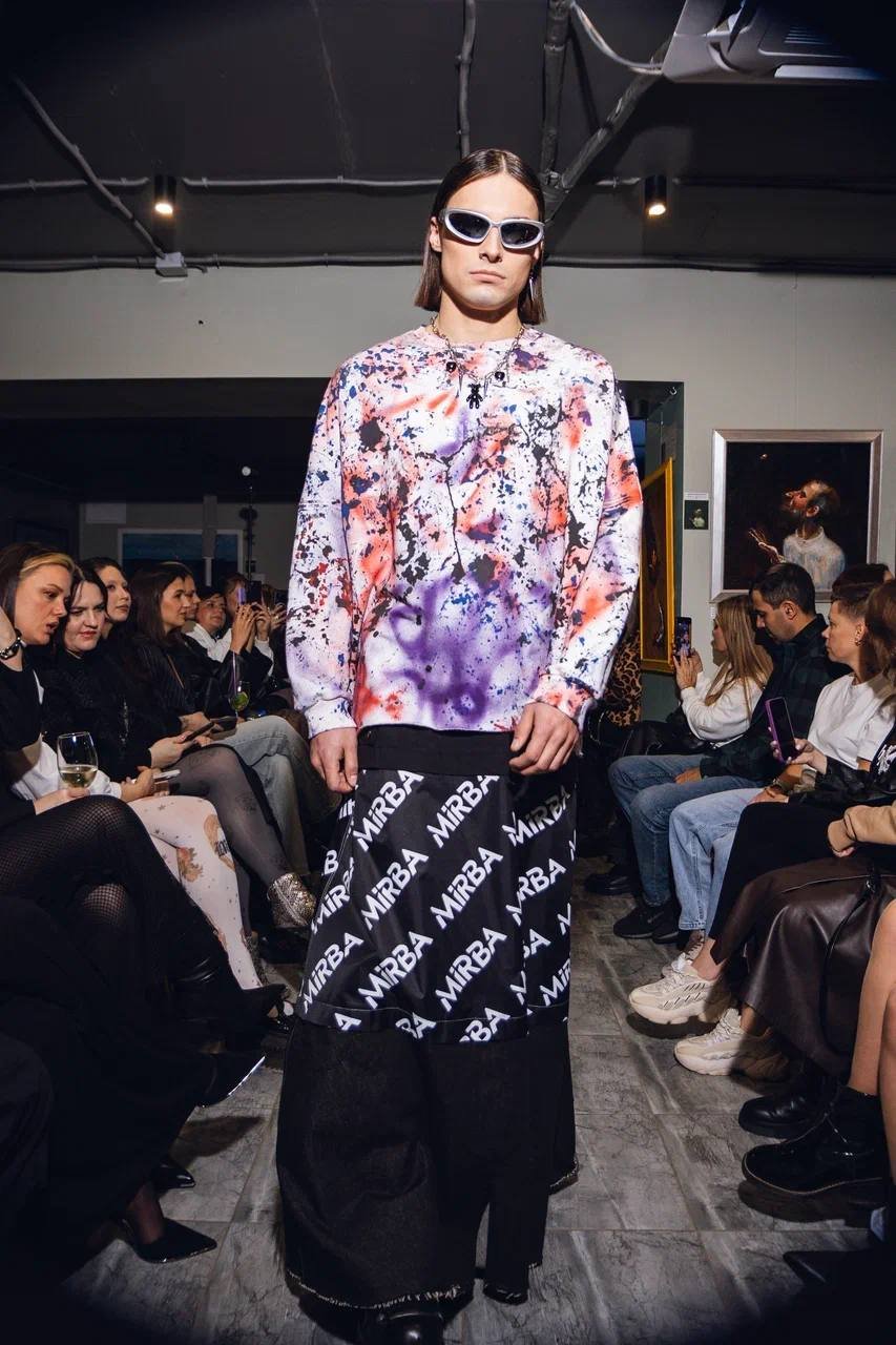  Konstantin Churakov — male fashion model represented by Noirvelle Models, walking the runway at a fashion show.

