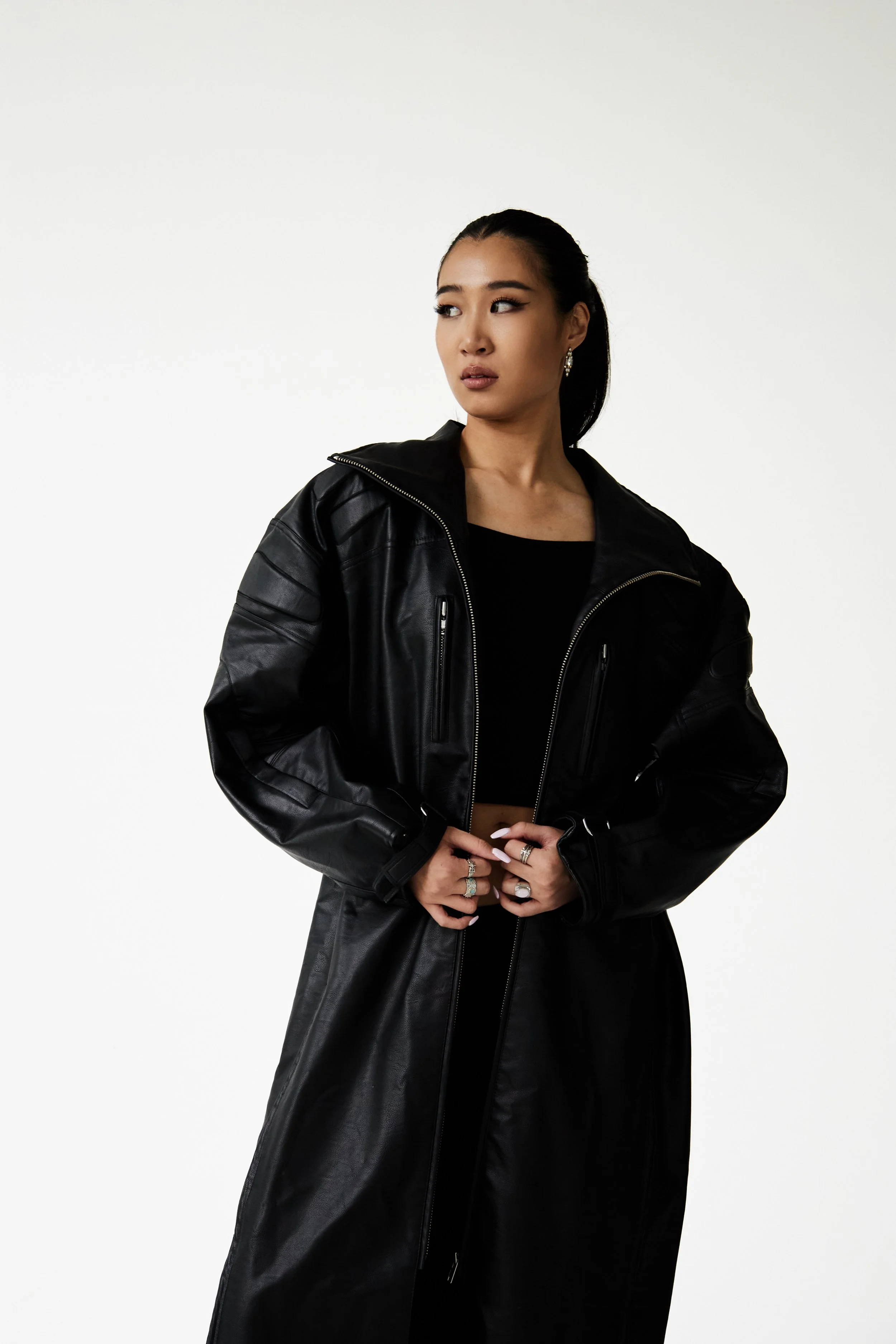  Joline, female fashion model represented by Noirvelle Models, full-length studio portrait wearing an all-black fashion look.
