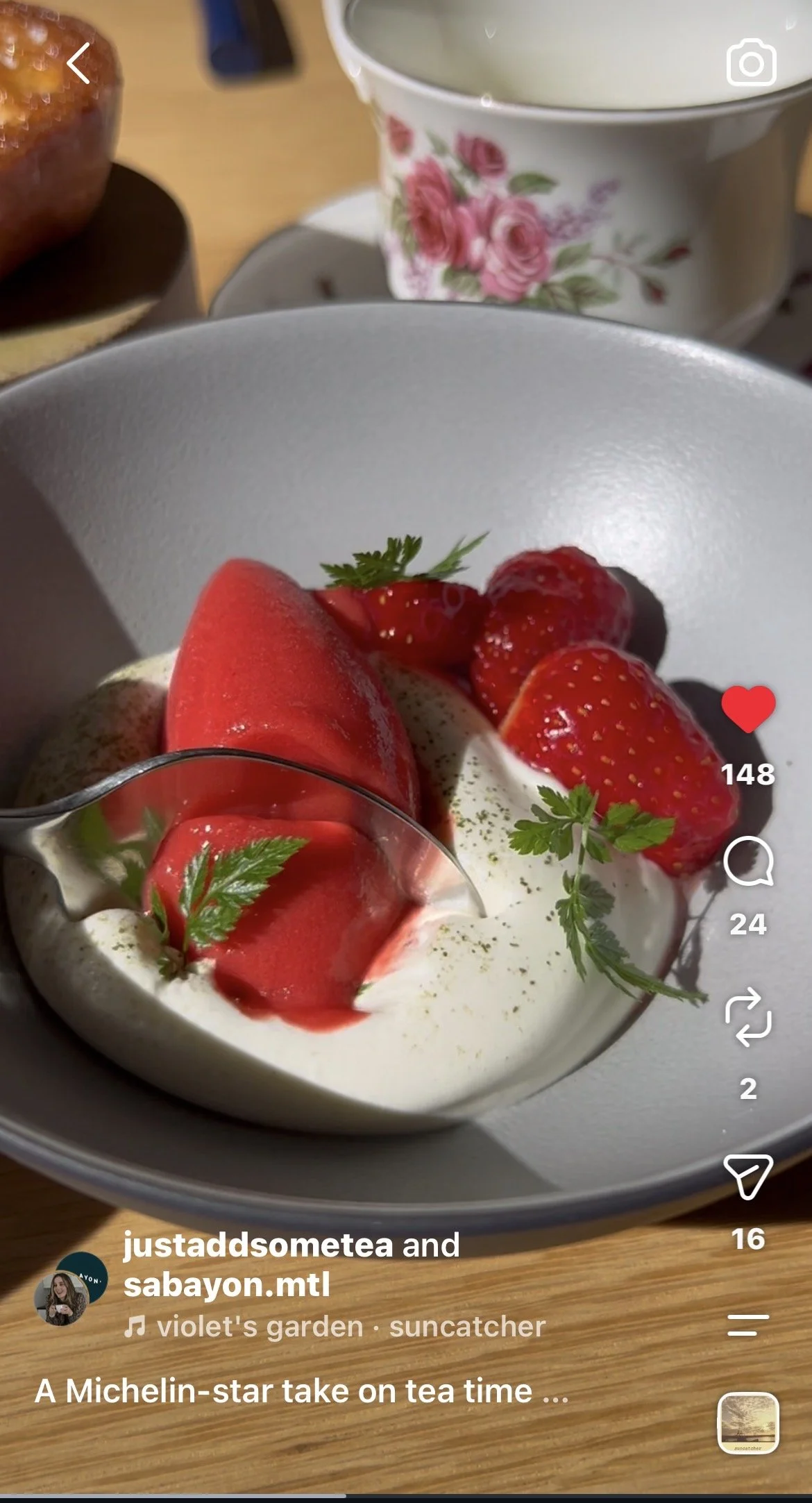 A bowl of whipped chantilly topped with strawberries beside a floral teacup and muffin — a cozy tea‑inspired dessert moment. Perfect for tea pairing, mindful eating, and wellness rituals.