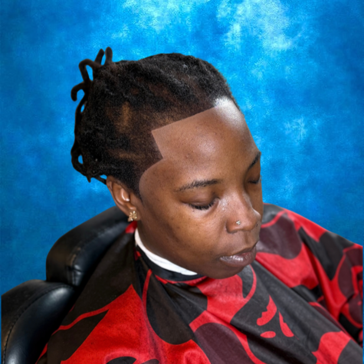 Close-up of a woman with dreadlocks, closed eyes, and a nose piercing, sitting in a chair with a blue textured background, wearing a red and black cape.