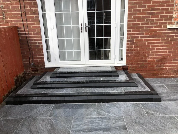 Porcelain steps up to French doors