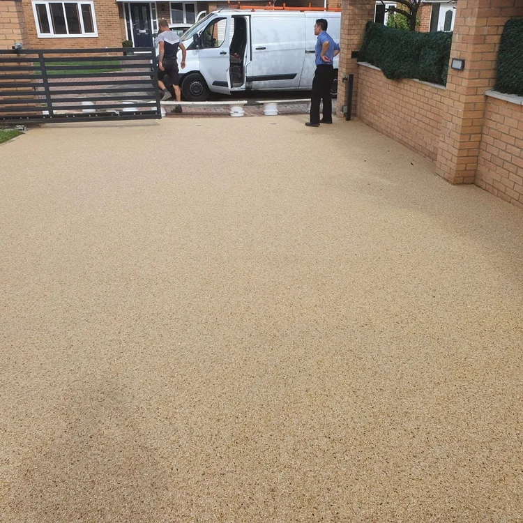 Large golden resin driveway, freshly laid