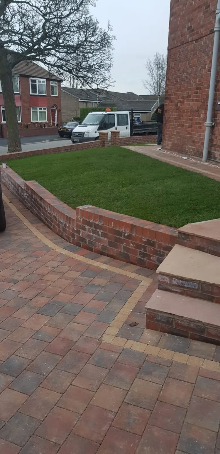 Front garden with a new lawn and block steps