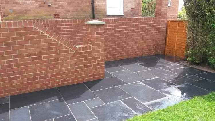Dark porcelain patio in a walled garden
