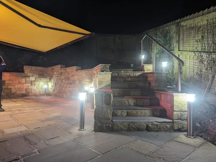 Sandstone steps and patio with low-level lighting