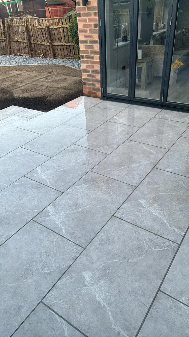Grey porcelain patio outside bi-fold doors