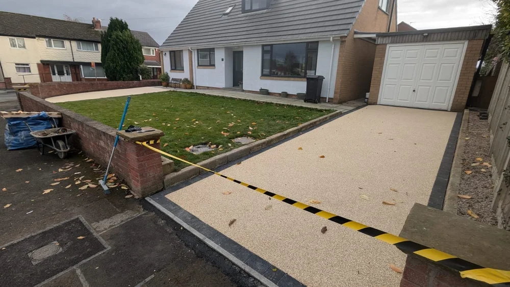 Resin driveway leading up to the garage