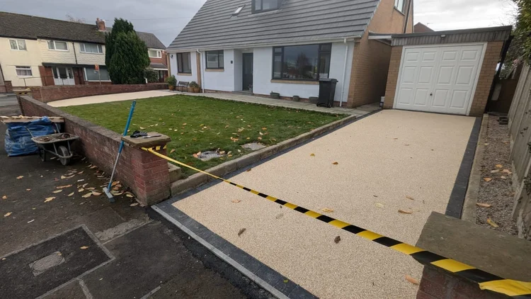 Resin driveway leading up to the garage