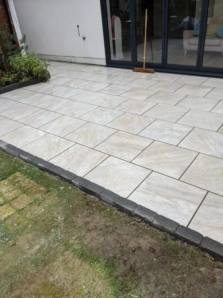 Cream porcelain patio with a charcoal edge