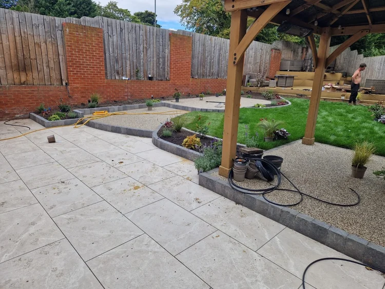 Garden makeover with a porcelain patio, gazebo and resin paths