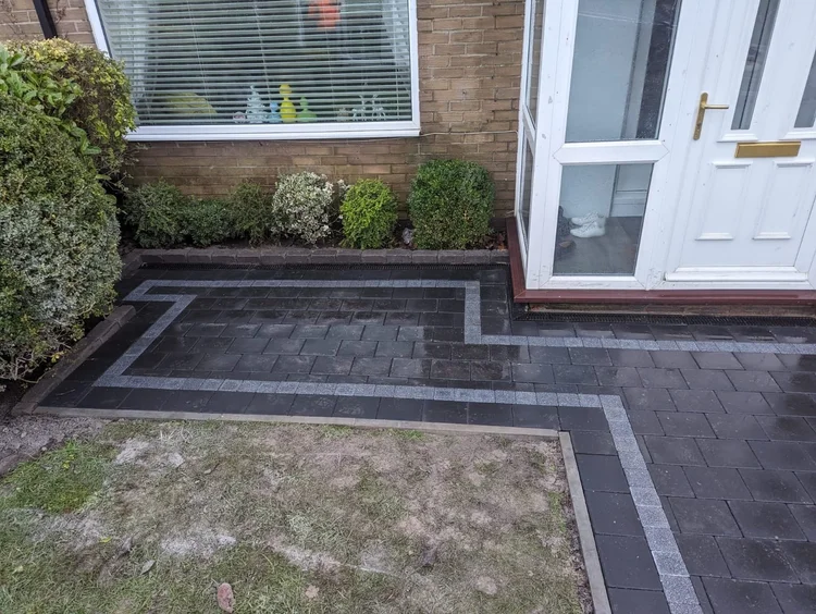 Charcoal block path with a contrasting border