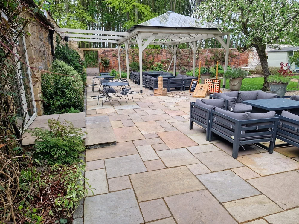 Sandstone terrace with a gazebo and outdoor seating