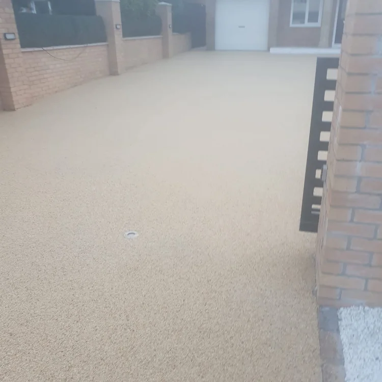 Resin driveway running to the garage