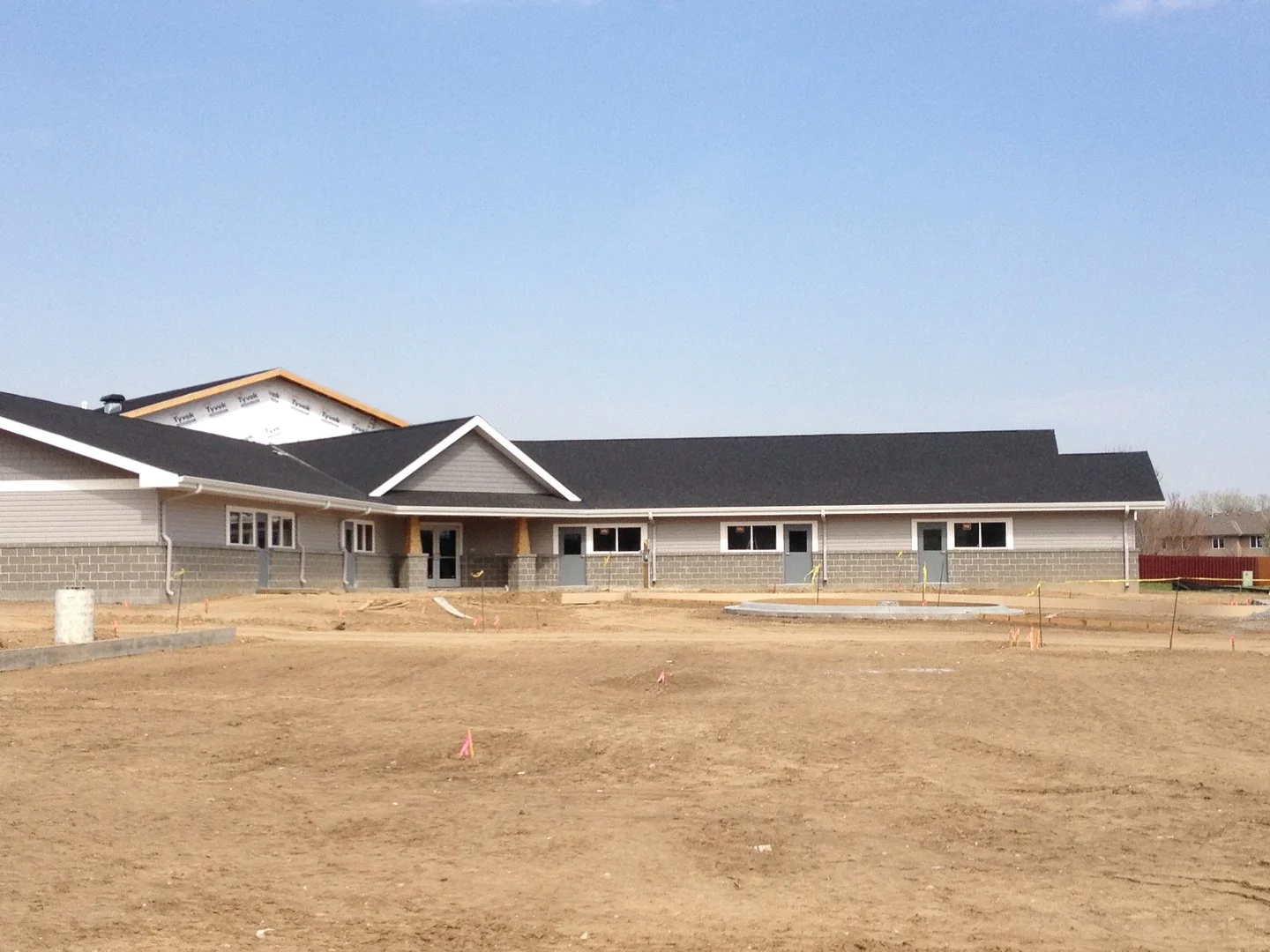 Commercial clubhouse with new-construction gutters installed by L&L