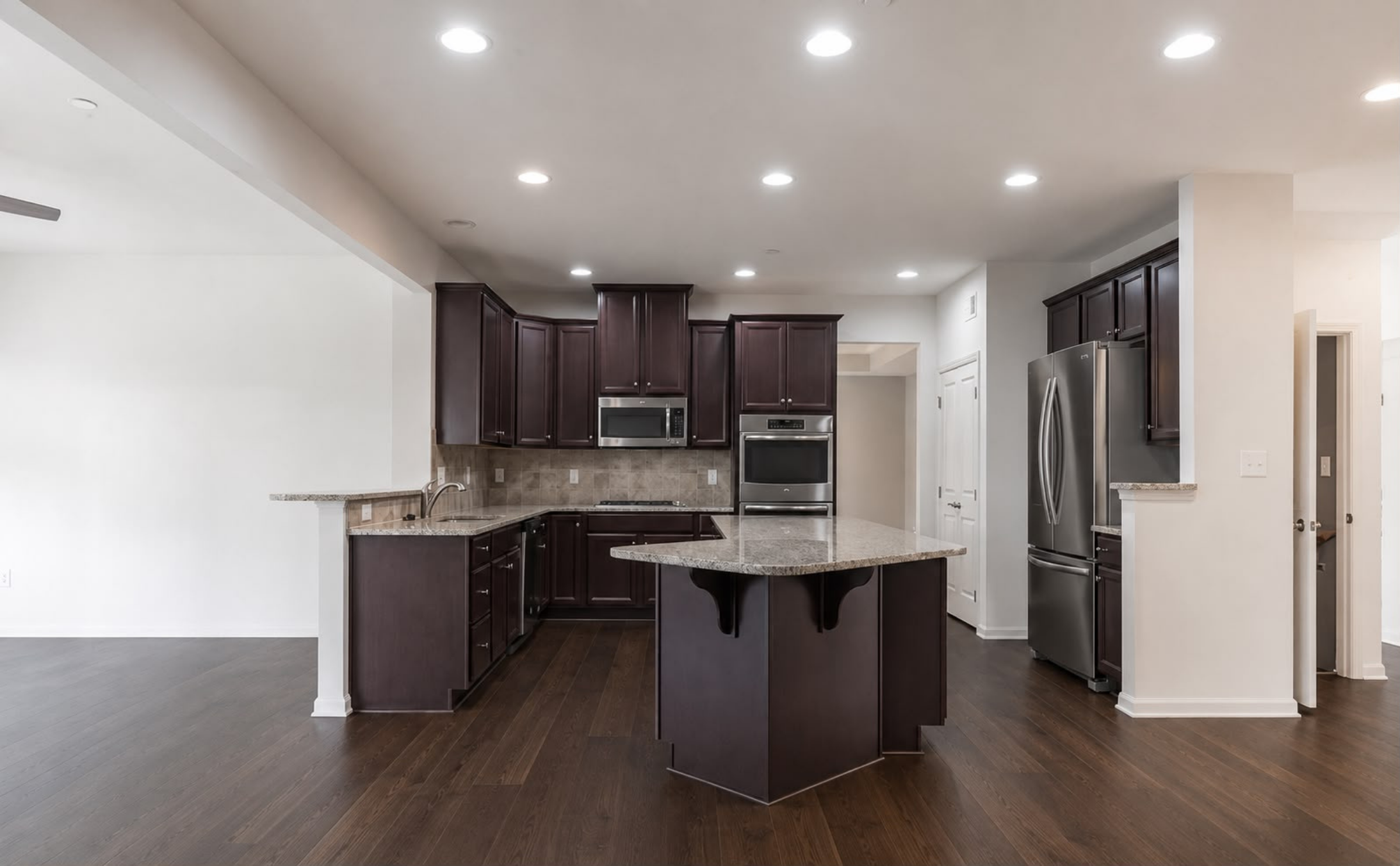 New flooring throughout, complemented by a custom sink and beautifully refinished cabinetry.