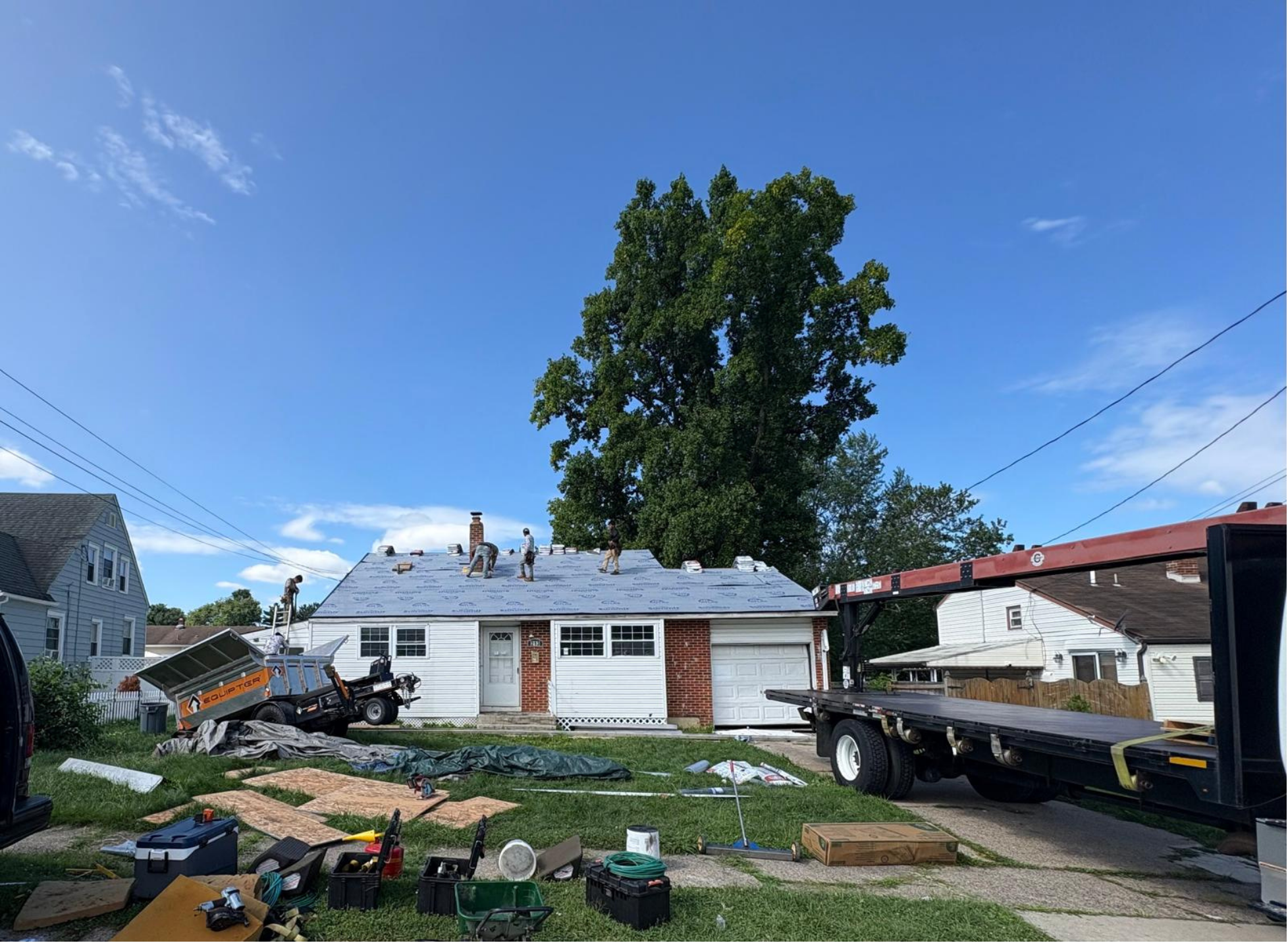 Brand-new roof with new shingles, underlayment, sheathing repairs, edge protection, and ridge ventilation.