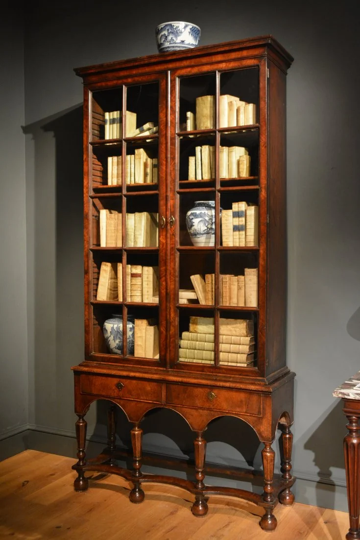 A George I veneered walnut glazed cabinet