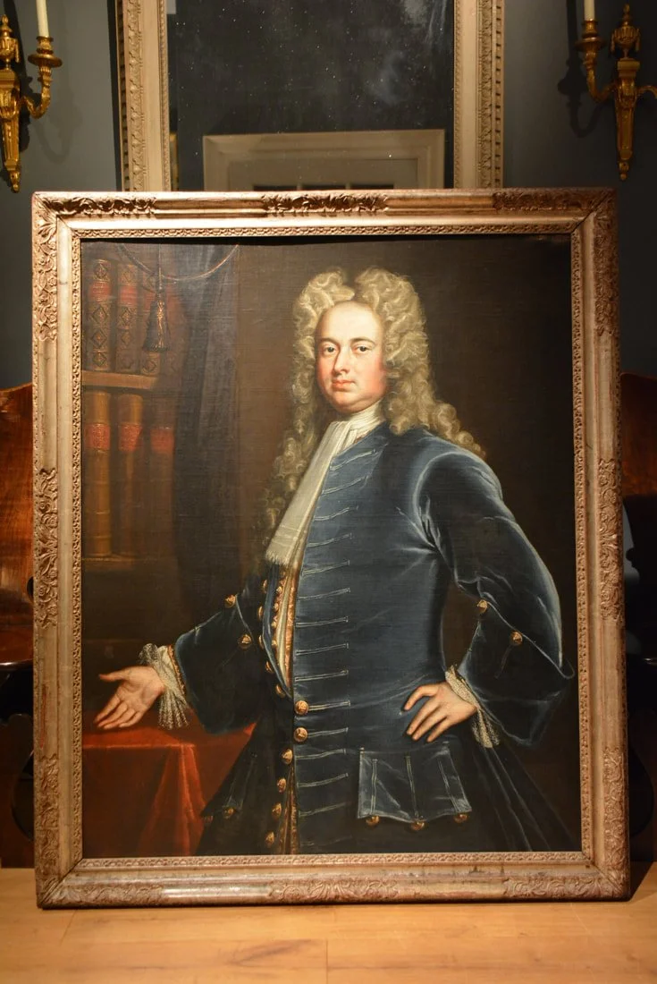 An early 18th Century portrait of a gentleman in its silvered frame