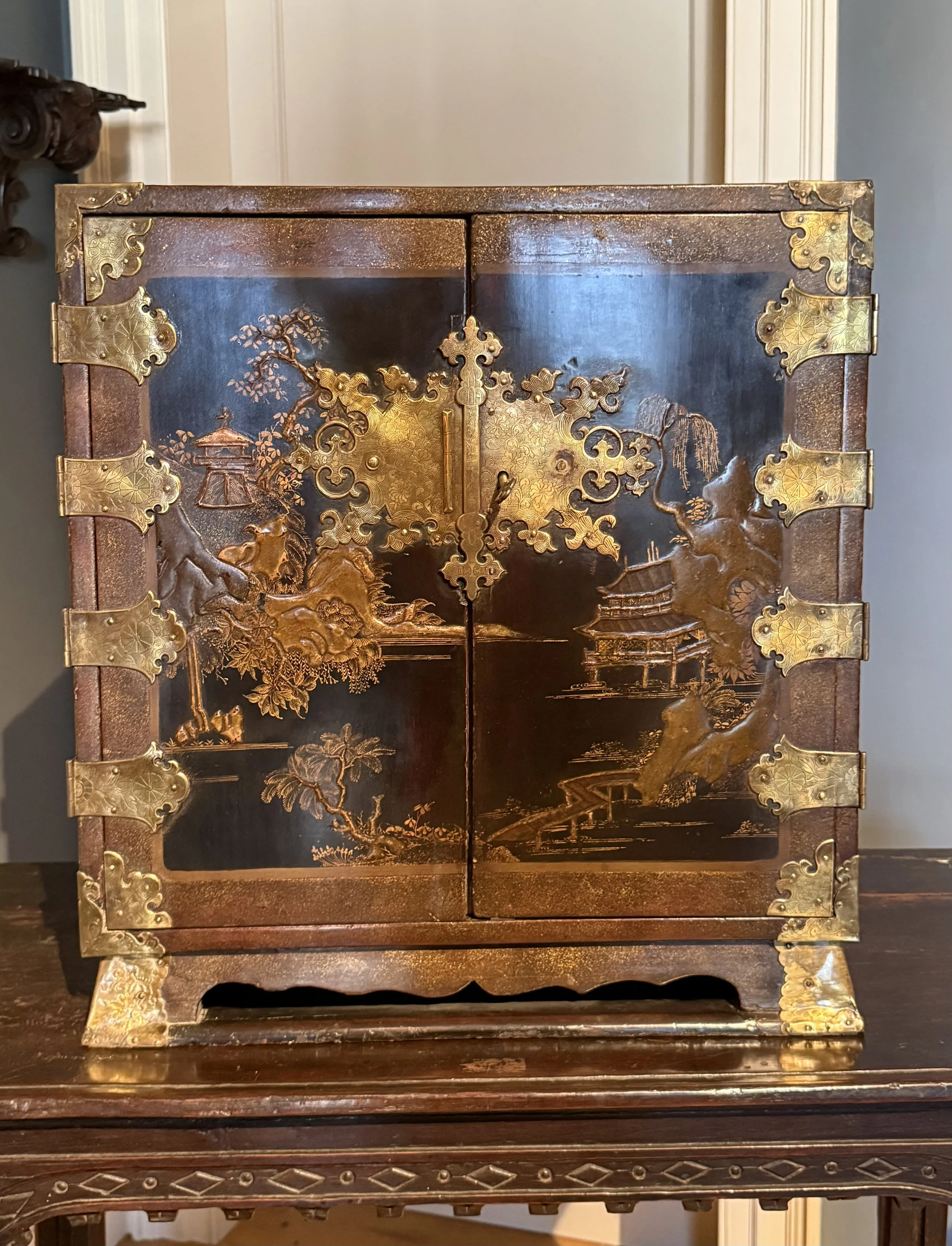 An early 18th Century Chinese lacquer table cabinet.