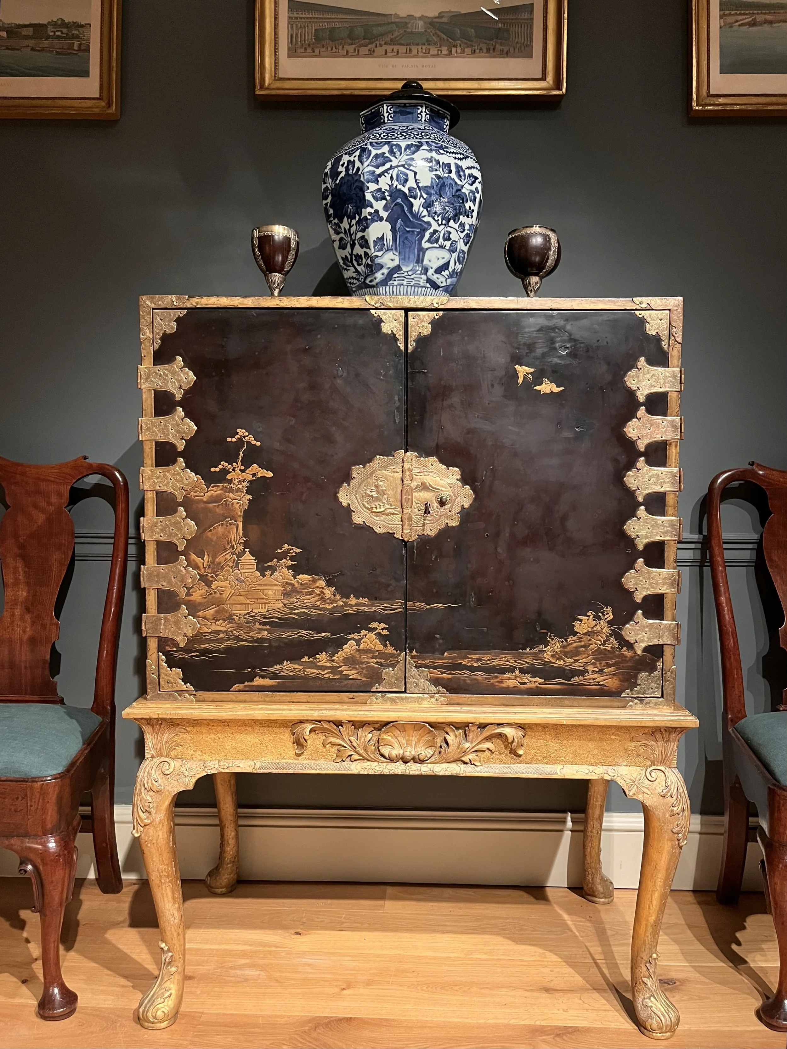 A late 17th Century Japanese lacquer cabinet standing on its English giltwood stand