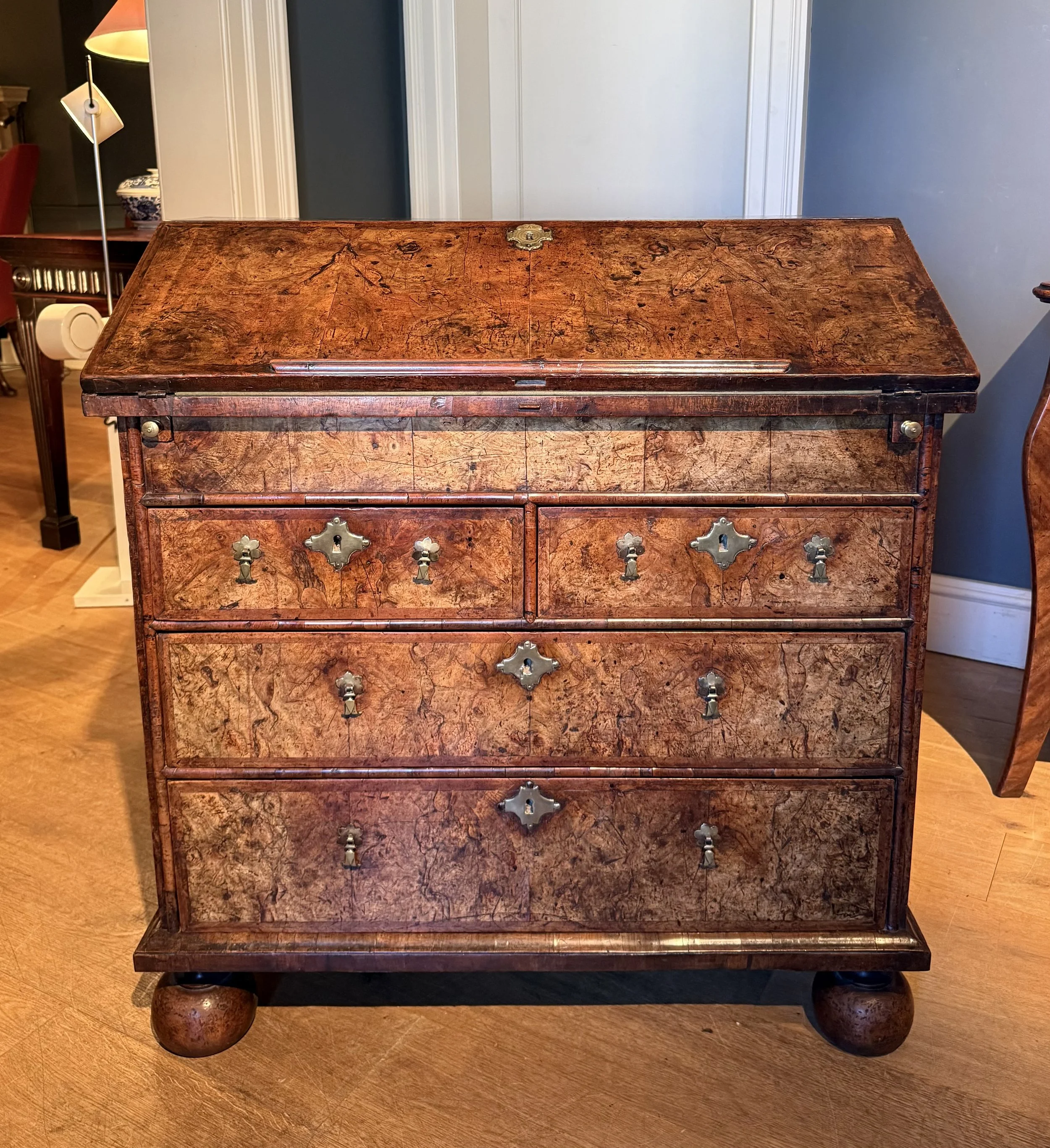 A burr walnut bureau circa 1700