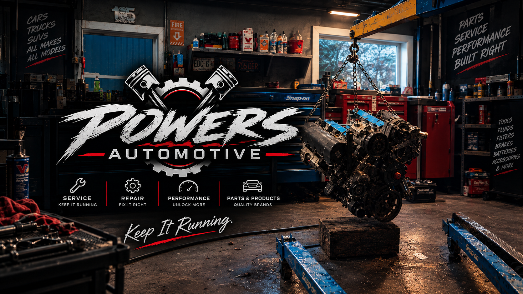 Inside an automotive workshop, a car engine is suspended by chains. Shelves and toolboxes are filled with car parts, fluids, and tools. A large sign displays the phrase 'Power's Automotive' with icons and text about service, repair, performance, and parts. The workshop has a dark, industrial look with a workbench, shelves, and large windows.