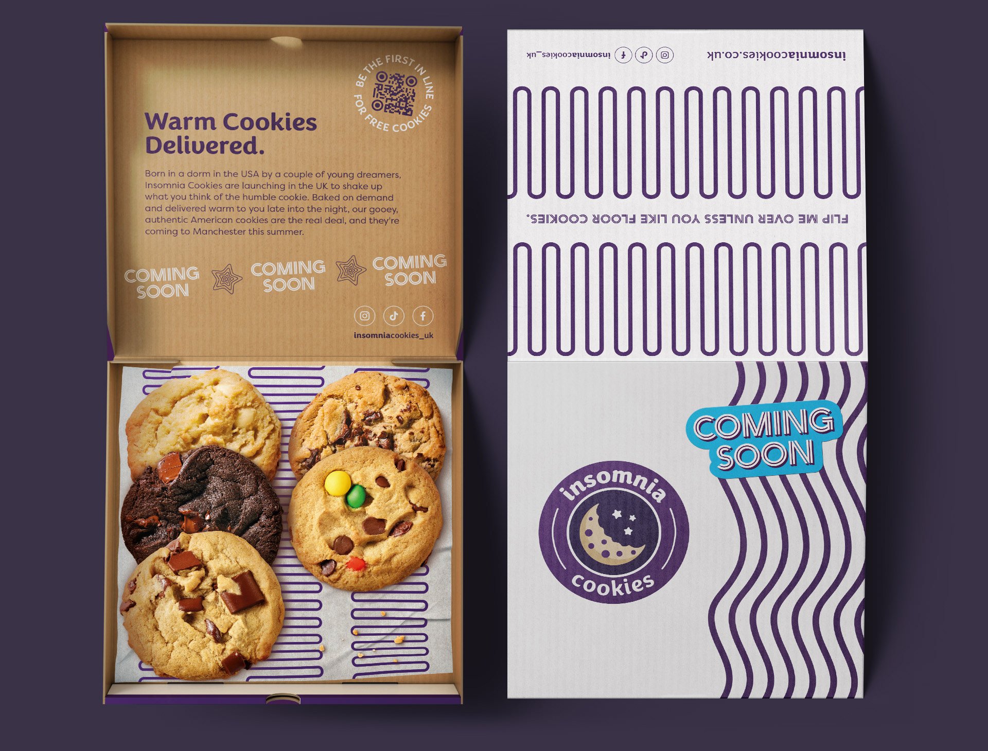 A box of assorted cookies with one cookie on a paper sheet and a box with purple and white striped packaging that reads "COMING SOON" and has social media icons and a QR code.
