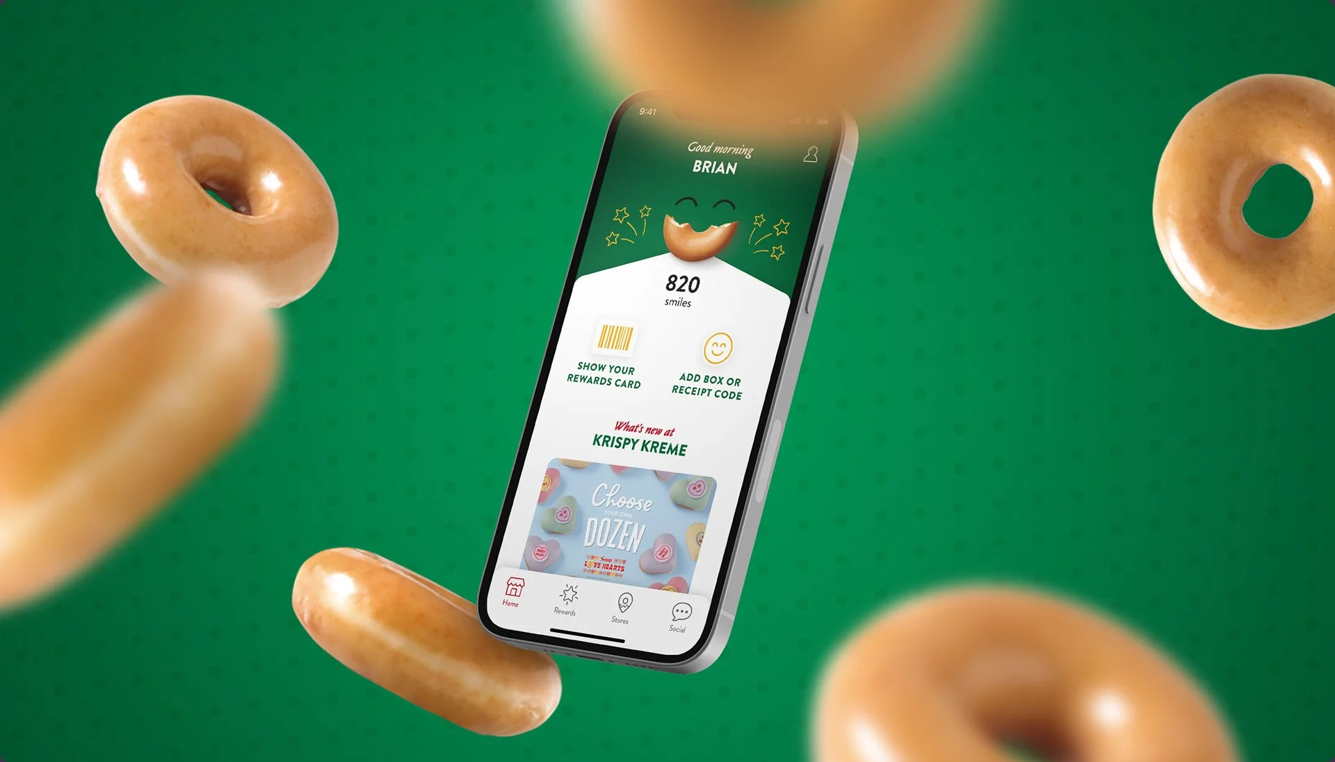 Smartphone displaying a rewards app on a green background with floating donuts