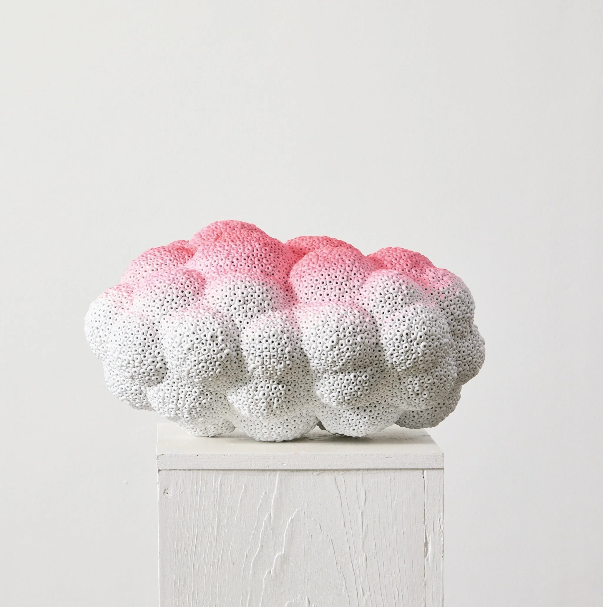 Biomorphic (accreted, white and pink), 2025 volcanic stone (hollow), stone dust, resin and pigment approx. 22 x 11 x 13 in 32lbs