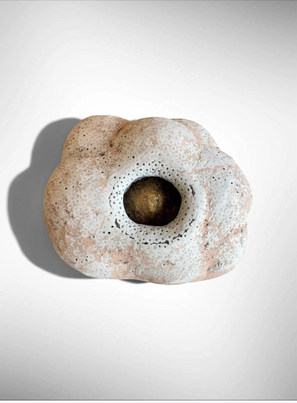 Contained, 2026 
volcanic stone (hollow), stone dust, resin, pigment and gold leaf 
approx. 12 x 10 x 8 in 