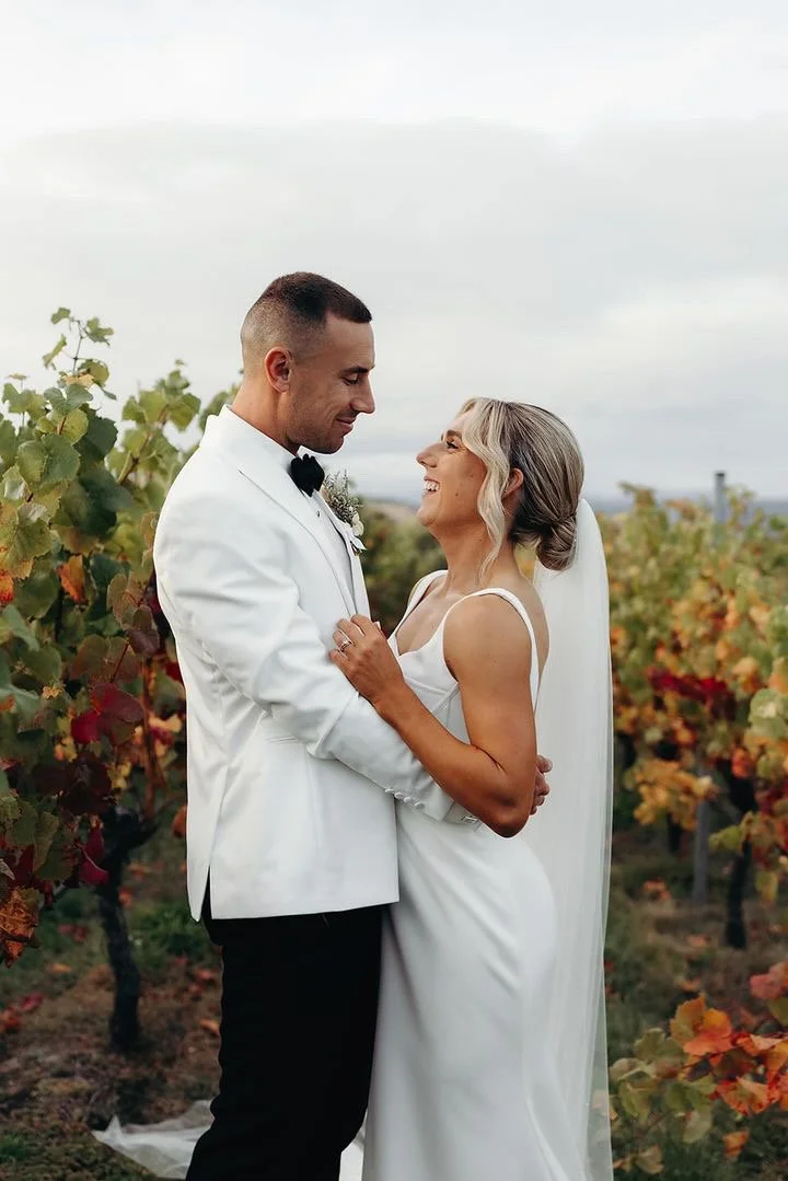 Bride and groom together at their vineyard wedding in Tasmania.