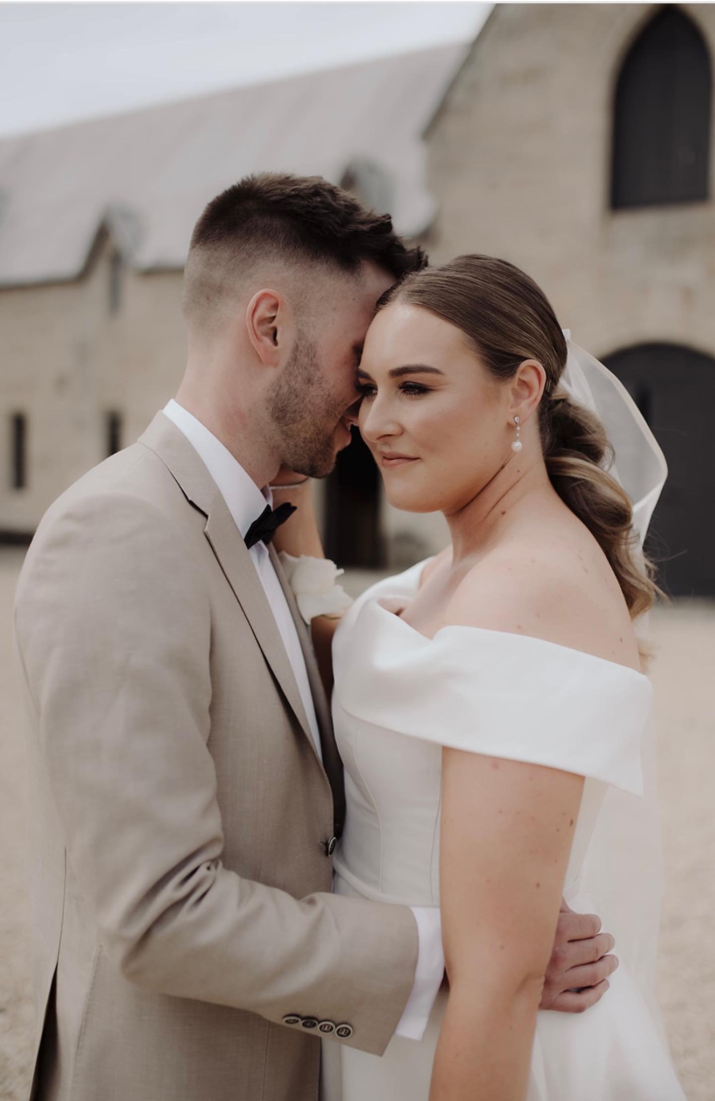 Bride and groom sharing a quiet moment together on their wedding day.