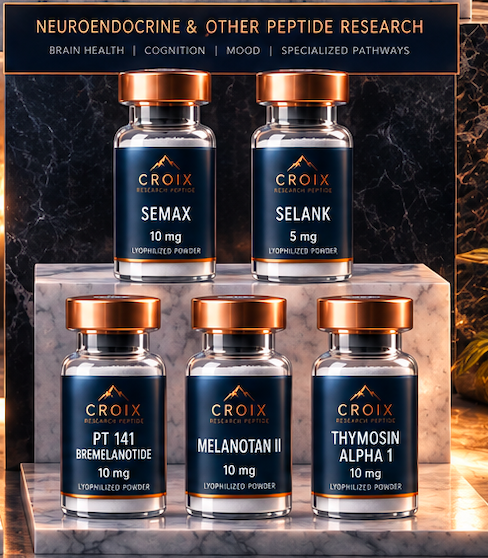 Six bottles of research peptides with black labels and gold caps on a marble surface, with a sign above them listing peptides and research areas.