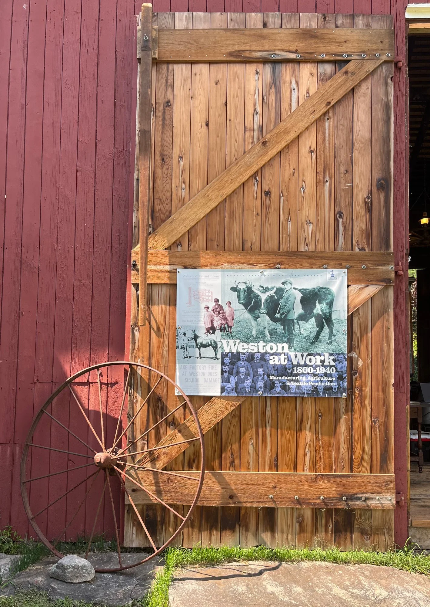 The Weston at Work banner on the Coley Barn's old plank door.