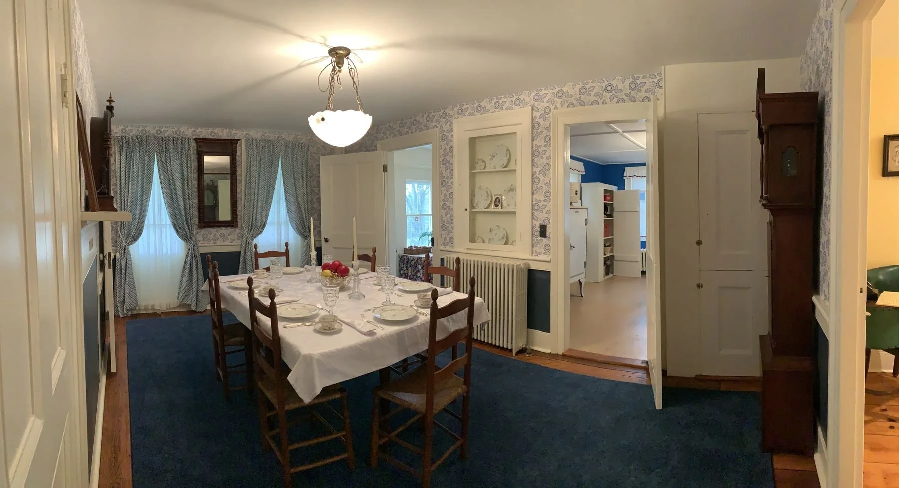 The dining room, once the house's 1841 kitchen, set for a meal.